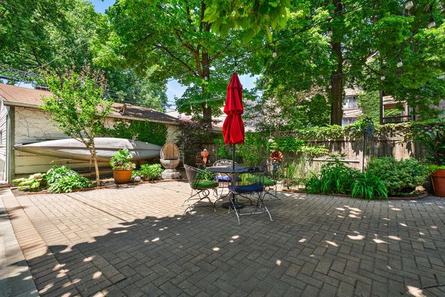 a view of a backyard with sitting area