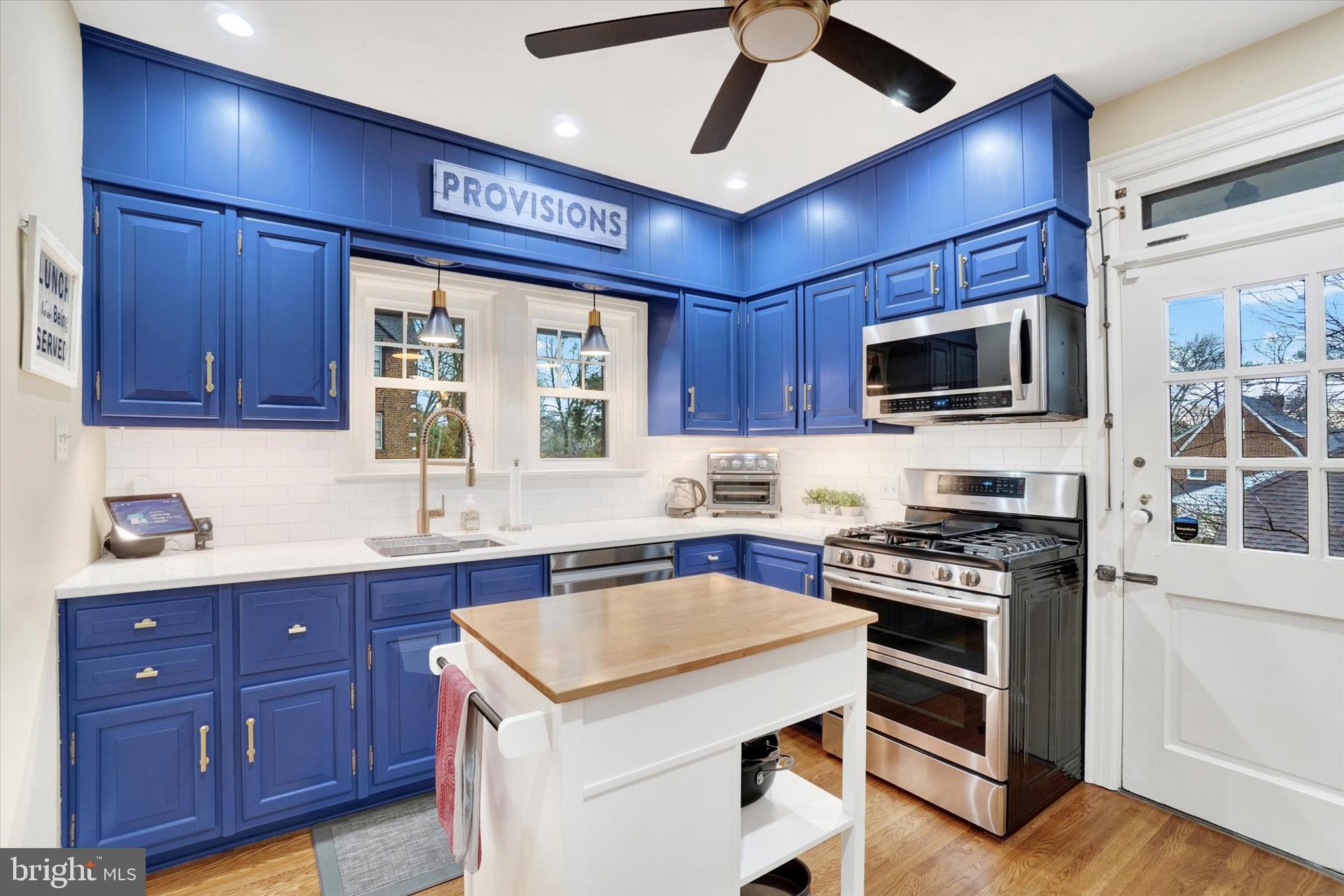 185 Peyton Road York, PA 17403 - Photo 15 of 38 a kitchen with stainless steel appliances granite countertop a stove sink microwave and refrigerator