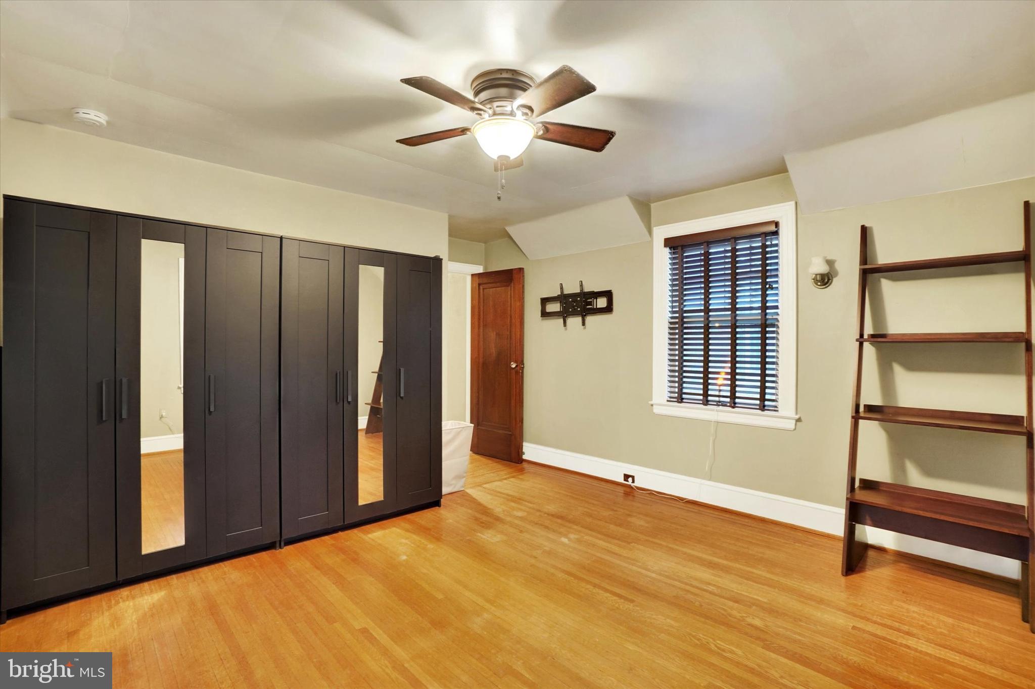 185 Peyton Road York, PA 17403 - Photo 22 of 38 a view of an empty room with a window and wooden floor