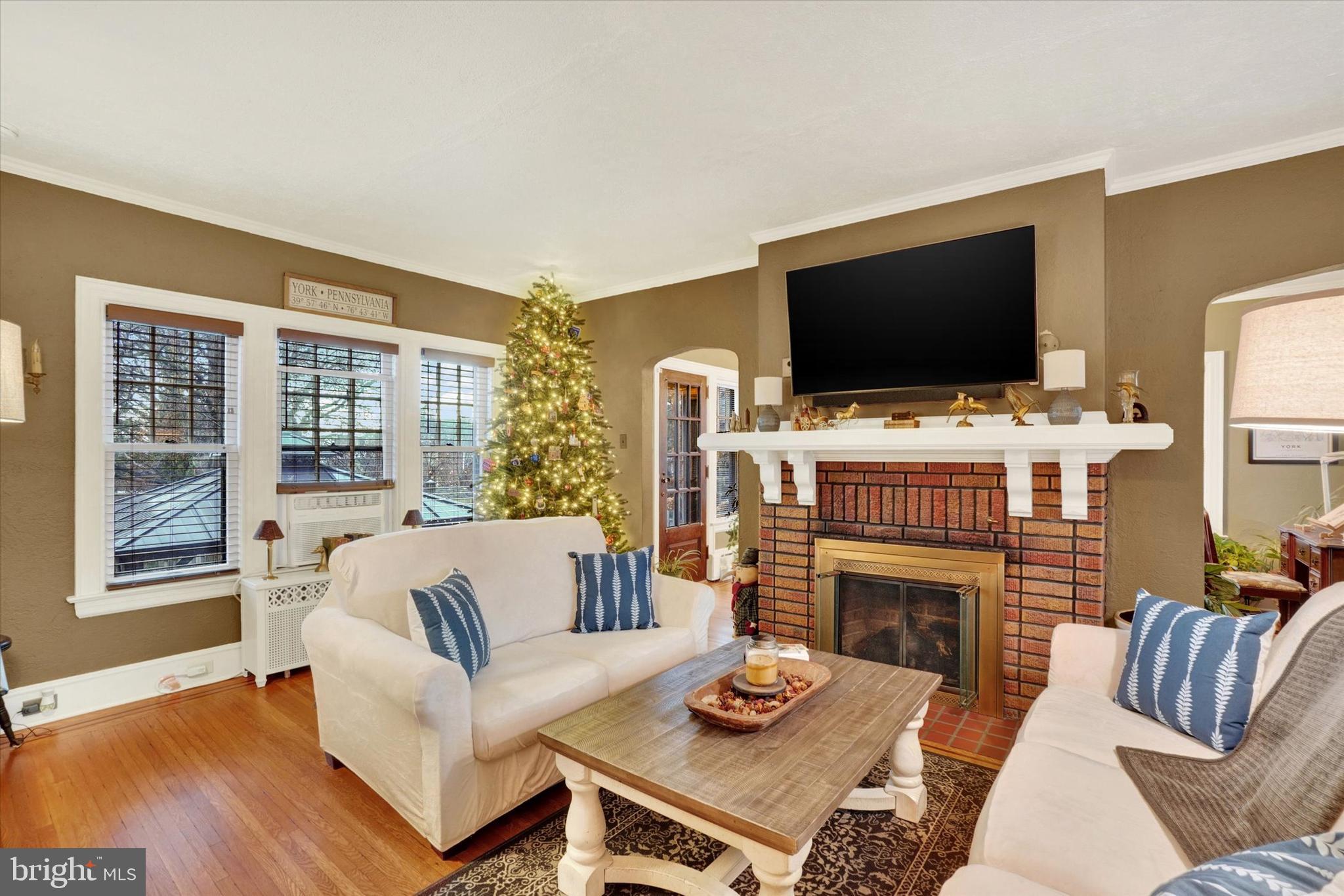 185 Peyton Road York, PA 17403 - Photo 7 of 38 a living room with furniture a flat screen tv and a fireplace