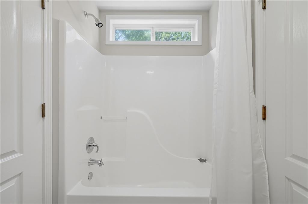 208 North Ridgeview Court Canton, GA 30115 - Photo 40 of 59 a close up of a bathtub with a white cabinet
