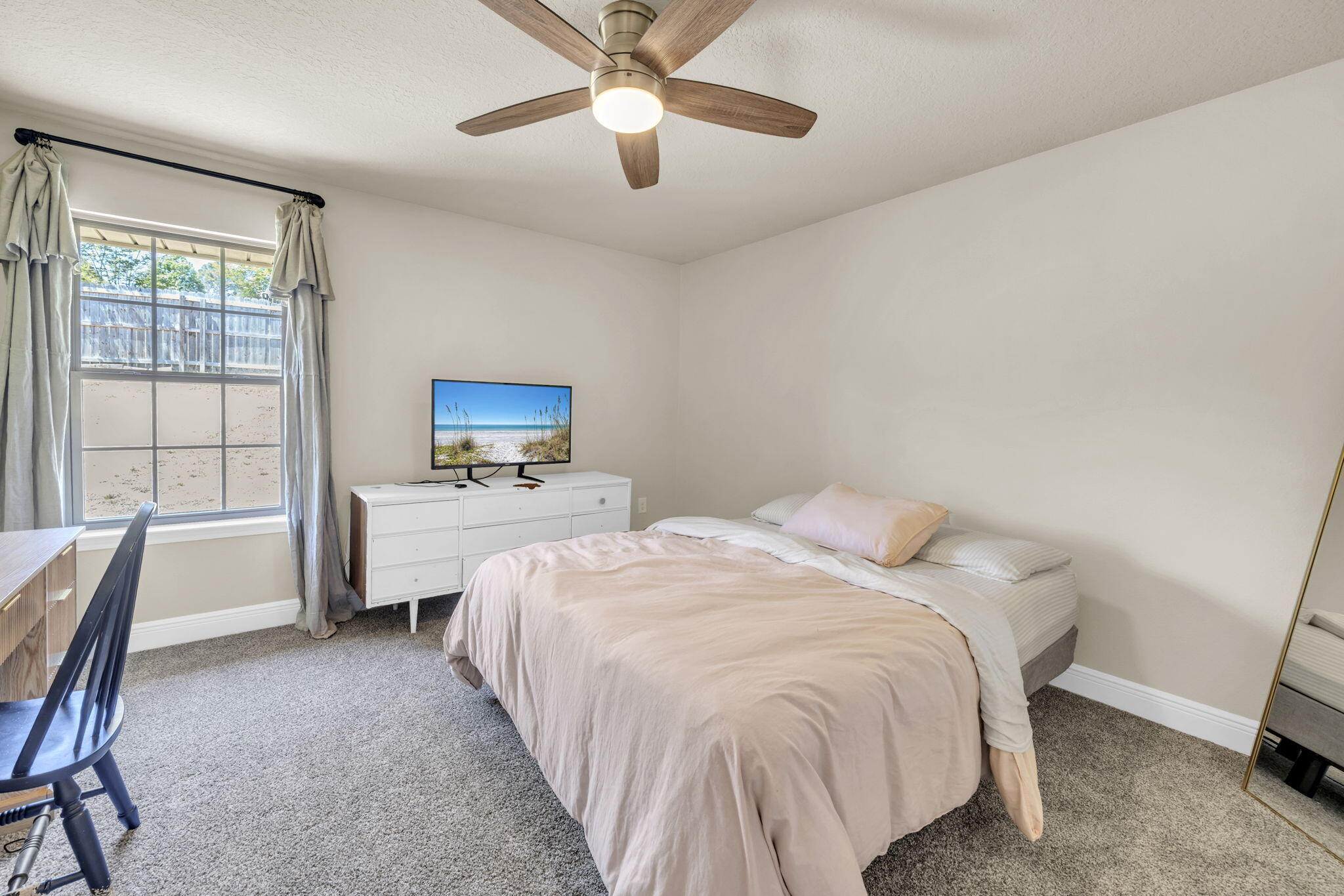 217 Raptor Drive Crestview, FL 32536 - Photo 43 of 48 a bedroom with a bed and a view of chair