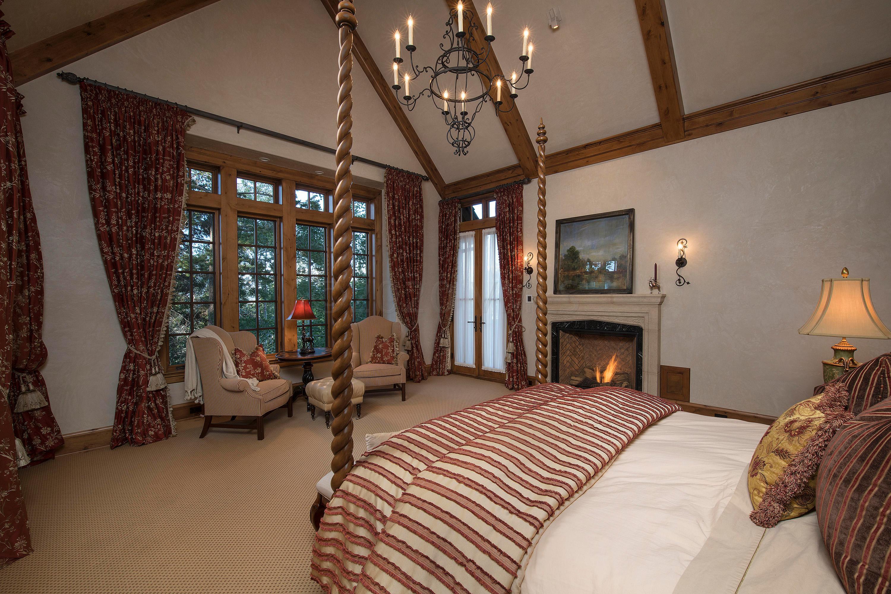 3882 Daybreak Ridge Road Avon, CO 81620 - Photo 12 of 33 a bed room with a bed and a chair