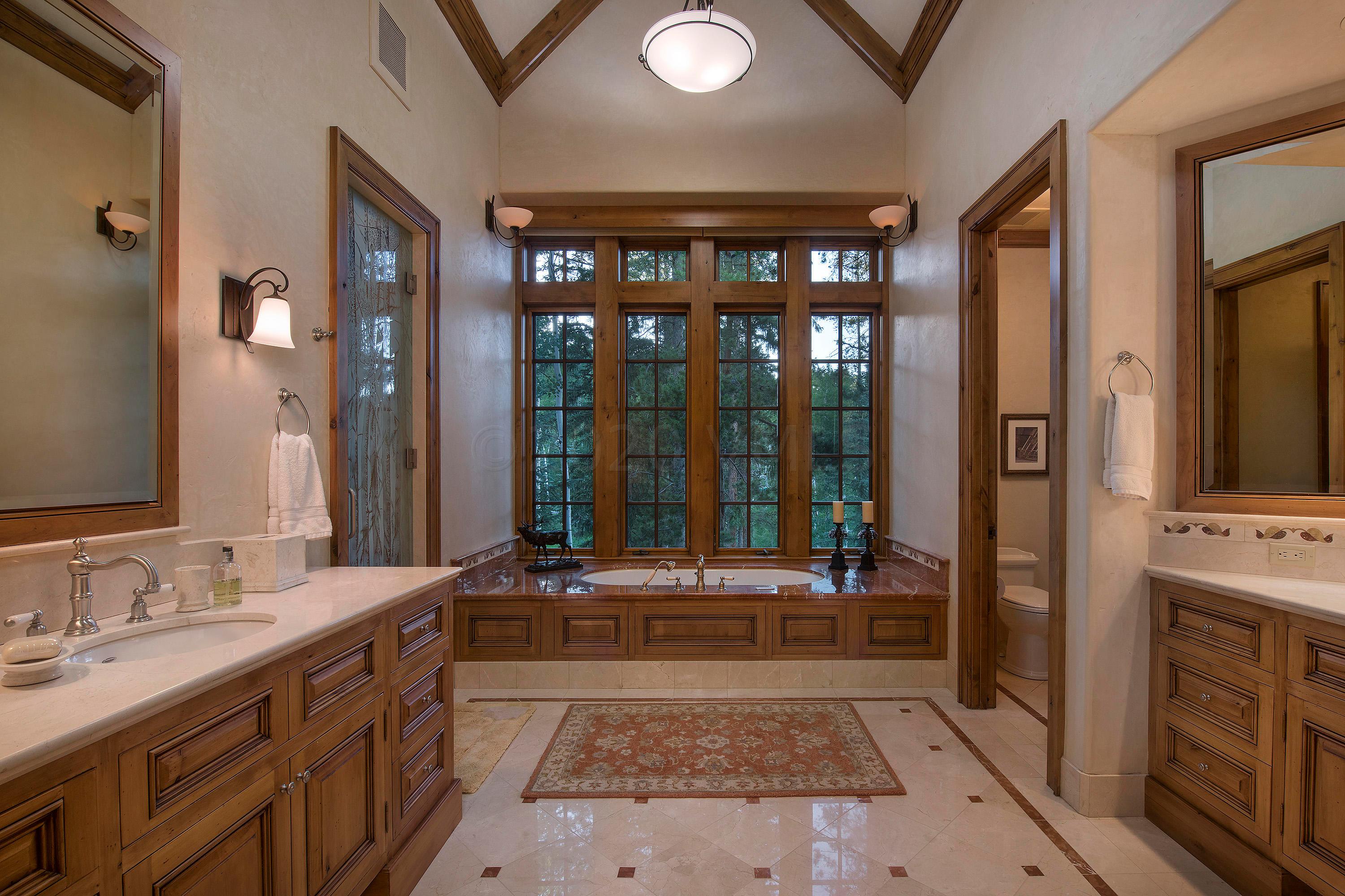 3882 Daybreak Ridge Road Avon, CO 81620 - Photo 13 of 33 a spacious bathroom with a tub sink and mirror