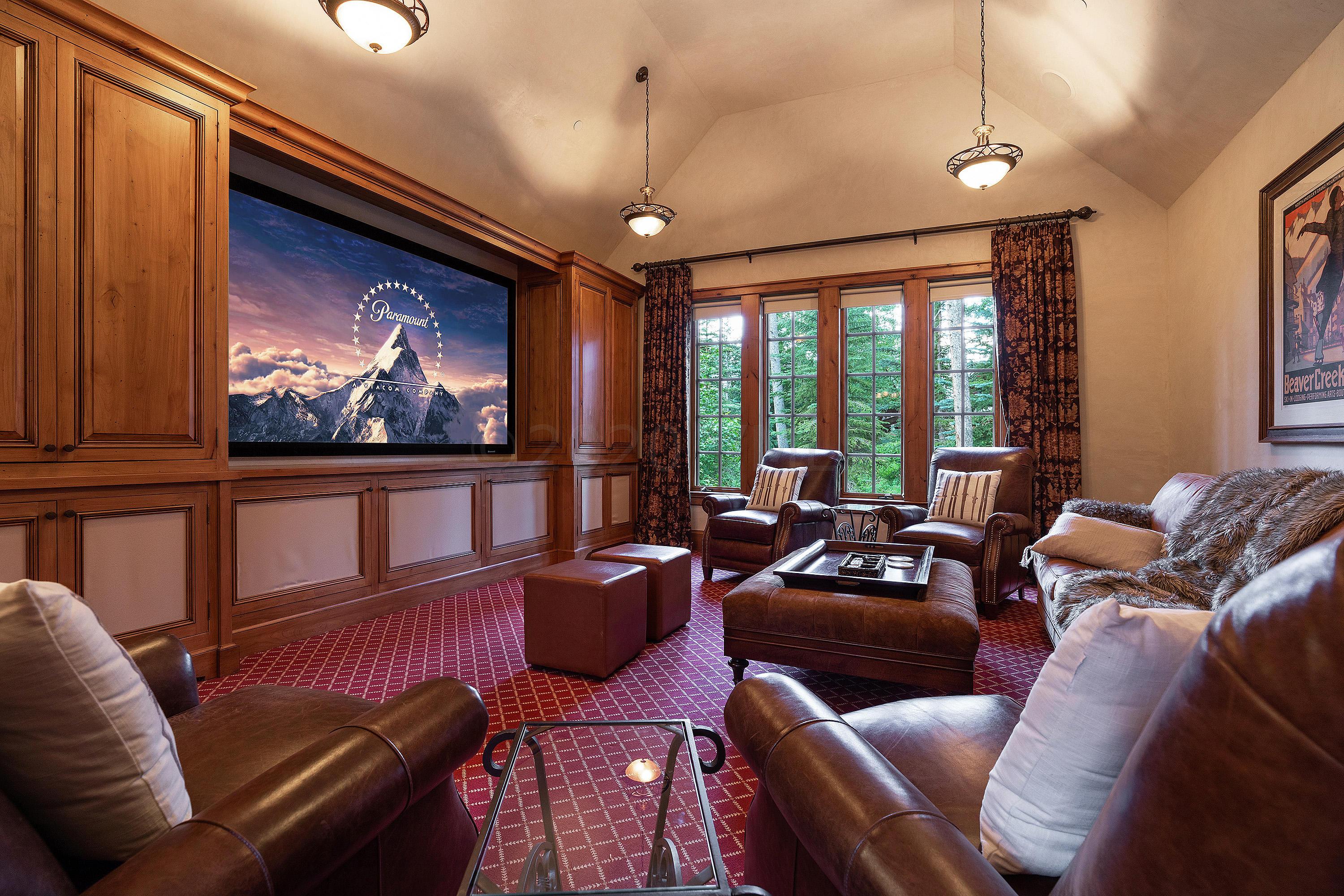 3882 Daybreak Ridge Road Avon, CO 81620 - Photo 16 of 33 a living room with furniture a flat screen tv and a large window