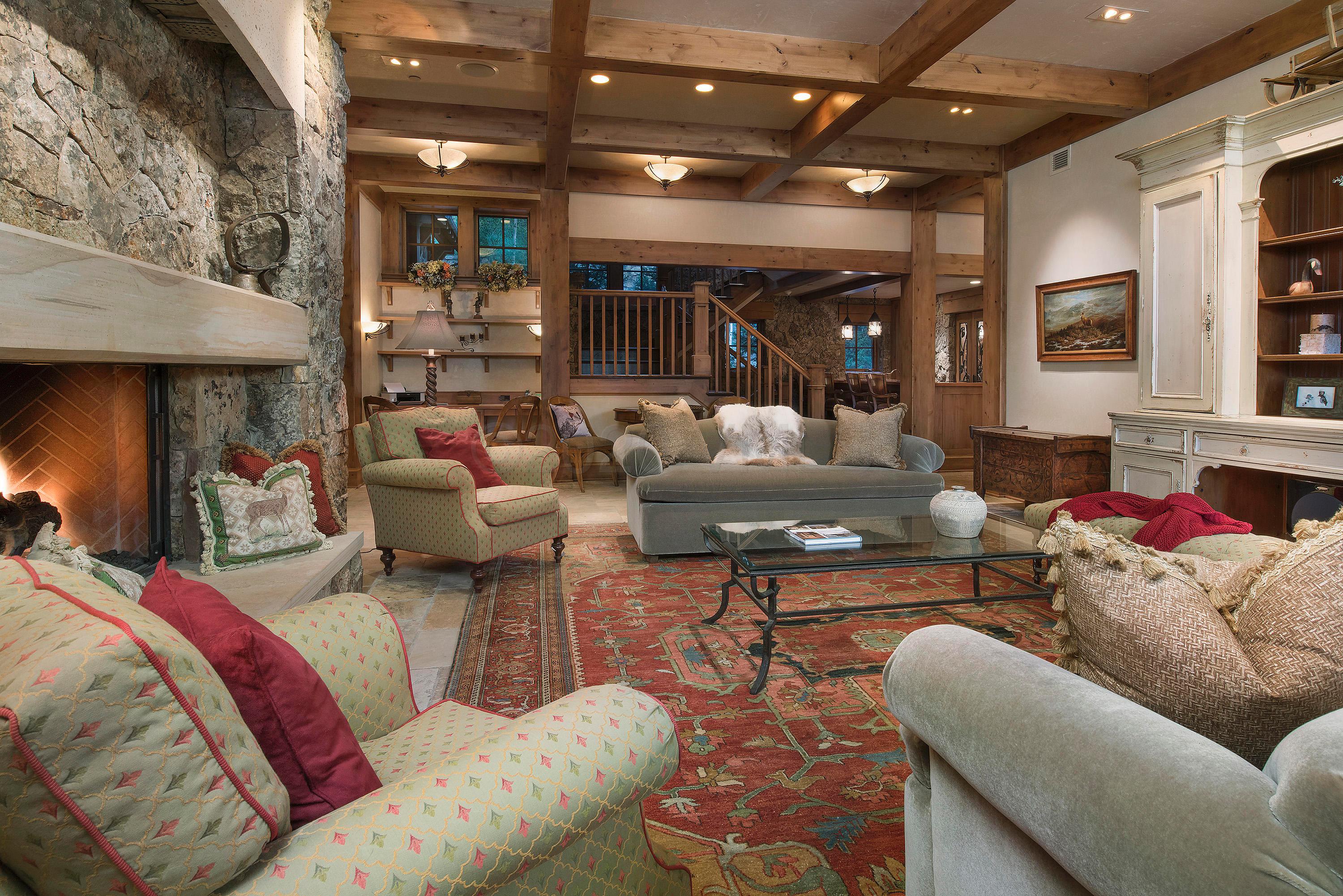 3882 Daybreak Ridge Road Avon, CO 81620 - Photo 18 of 33 a living room with furniture and a fireplace