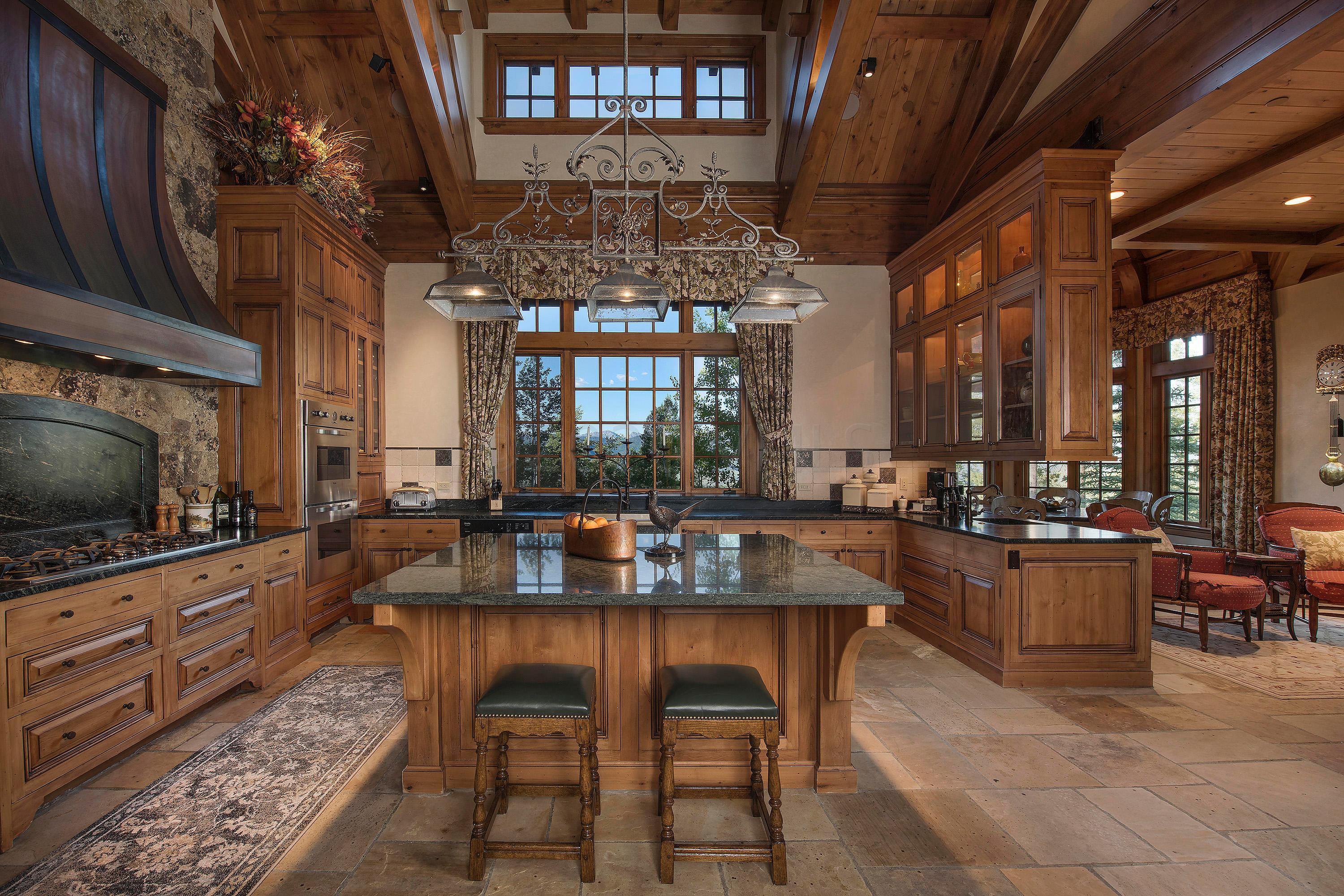 3882 Daybreak Ridge Road Avon, CO 81620 - Photo 2 of 33 a living room with furniture and a flat screen tv