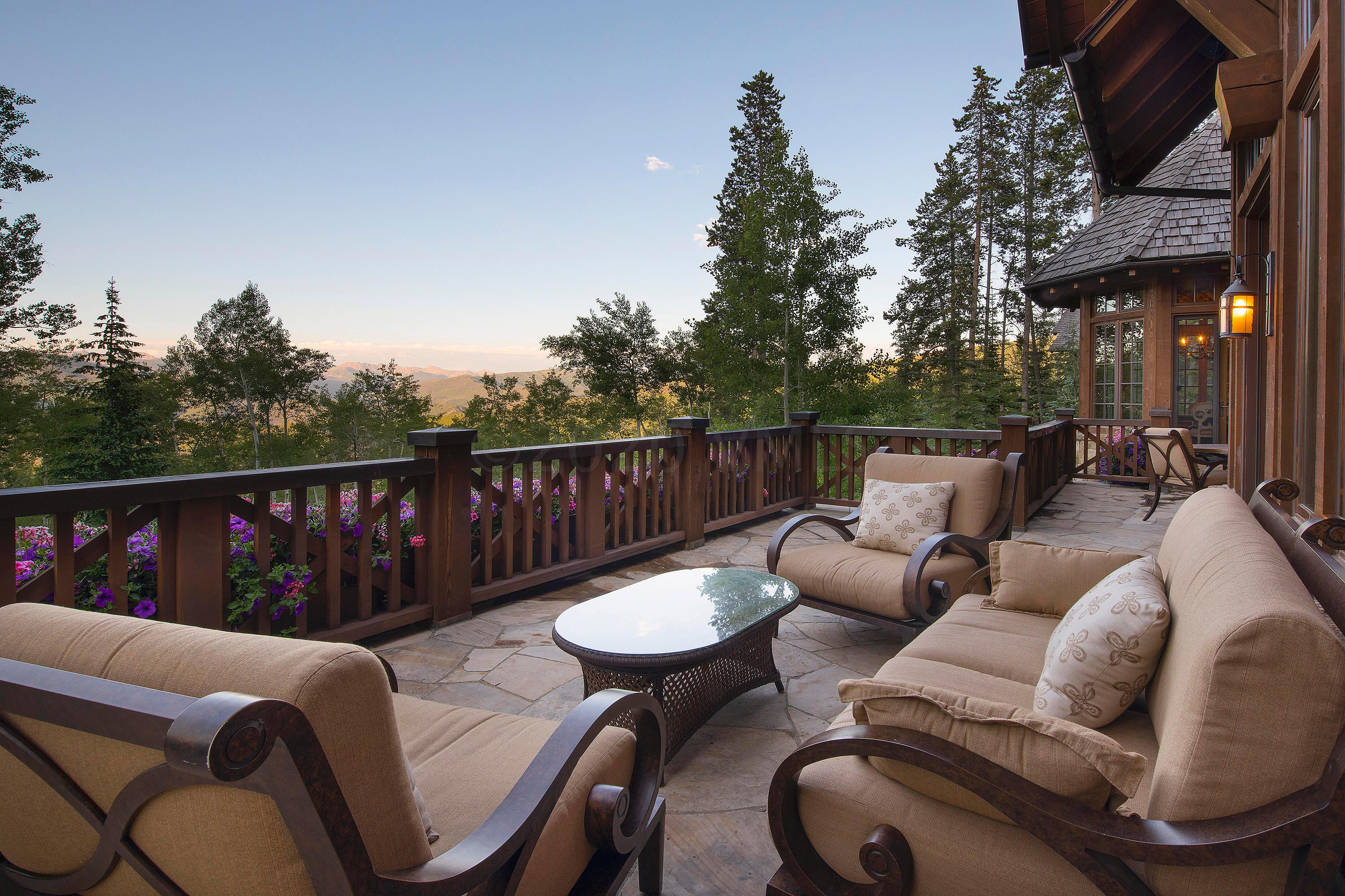 3882 Daybreak Ridge Road Avon, CO 81620 - Photo 29 of 33 a balcony with table and chairs