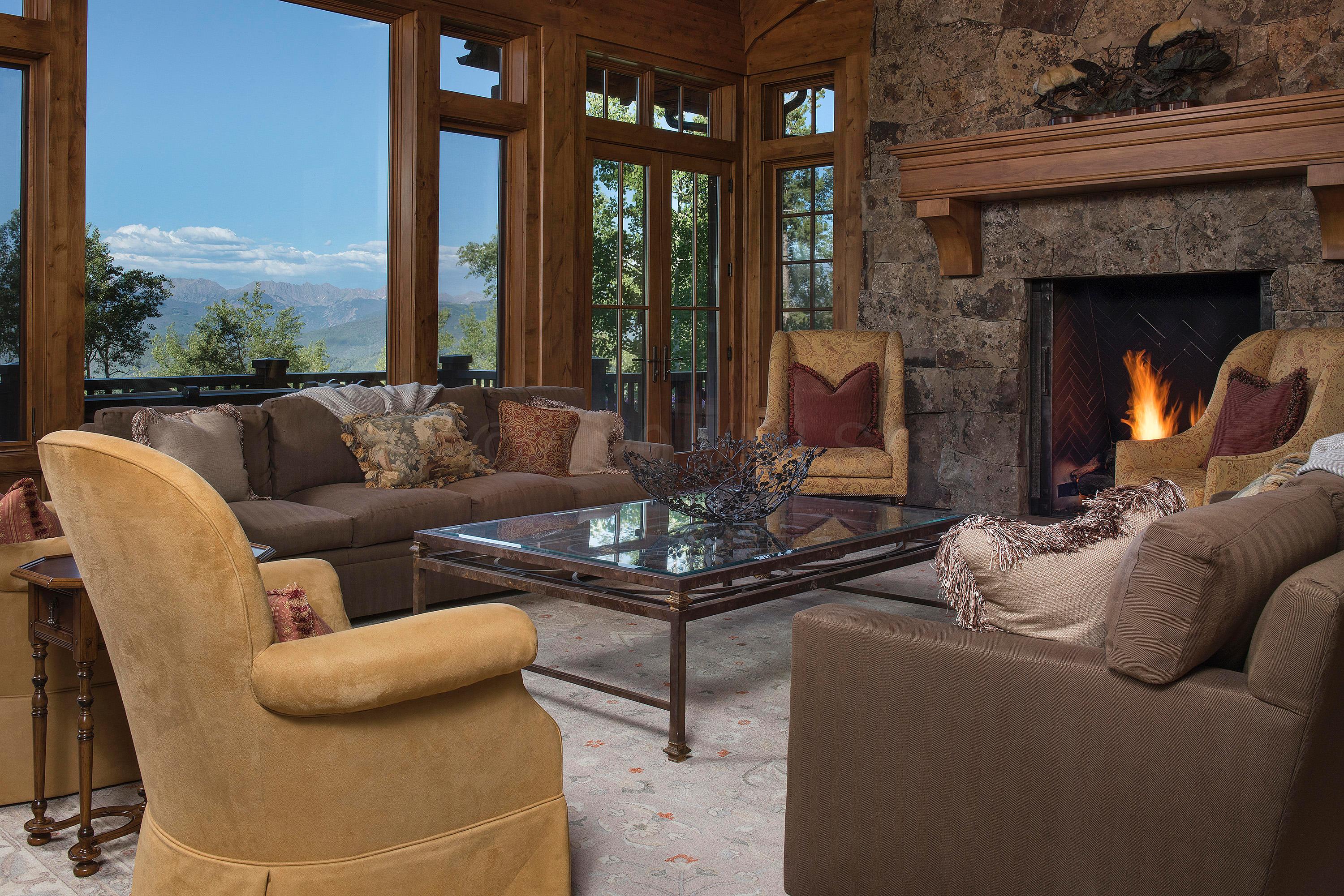 3882 Daybreak Ridge Road Avon, CO 81620 - Photo 6 of 33 a living room with furniture and a large window
