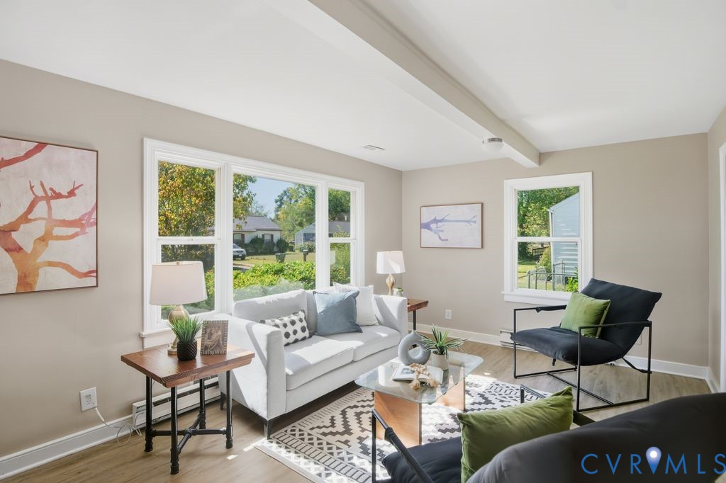 a living room with furniture and a window