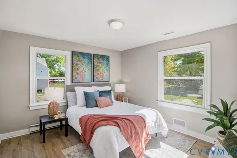 a bedroom with a large bed and a window