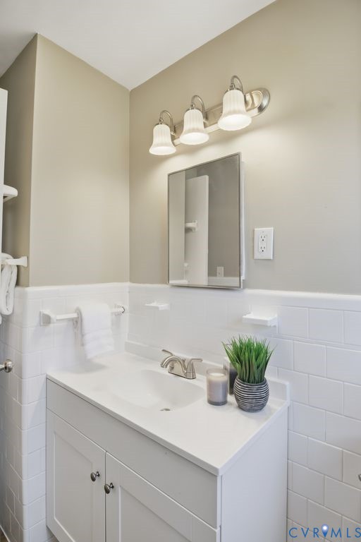 4216 Sheffield Road Richmond, VA 23224 - Photo 14 of 23 a bathroom with a sink and a mirror