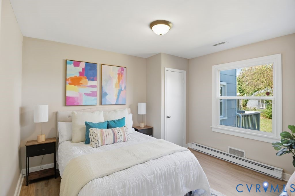 4216 Sheffield Road Richmond, VA 23224 - Photo 15 of 23 a bedroom with a bed and a window