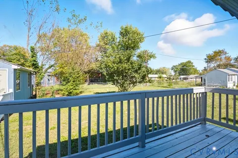 a view of a balcony with wooden floor