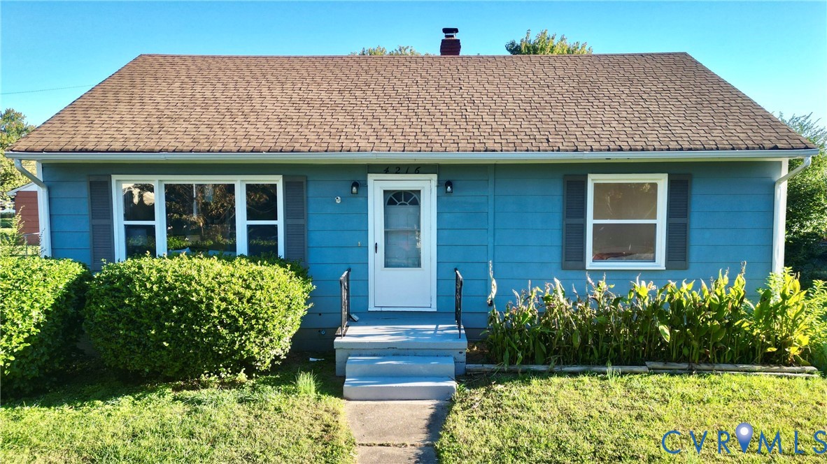 4216 Sheffield Road Richmond, VA 23224 - Photo 22 of 23 a front view of a house with garden