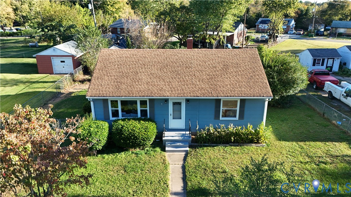4216 Sheffield Road Richmond, VA 23224 - Photo 23 of 23 a front view of a house with garden