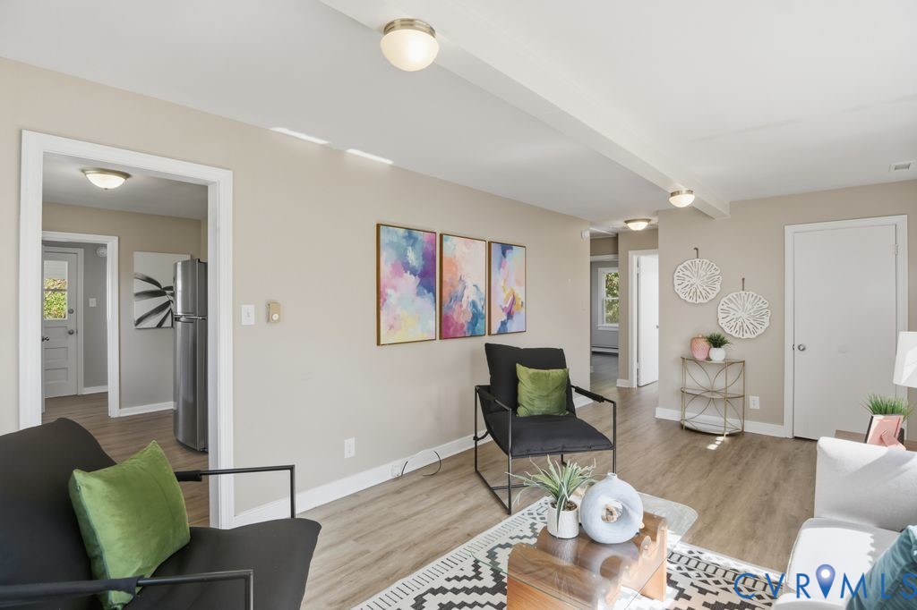 4216 Sheffield Road Richmond, VA 23224 - Photo 6 of 23 a living room with furniture and wooden floor