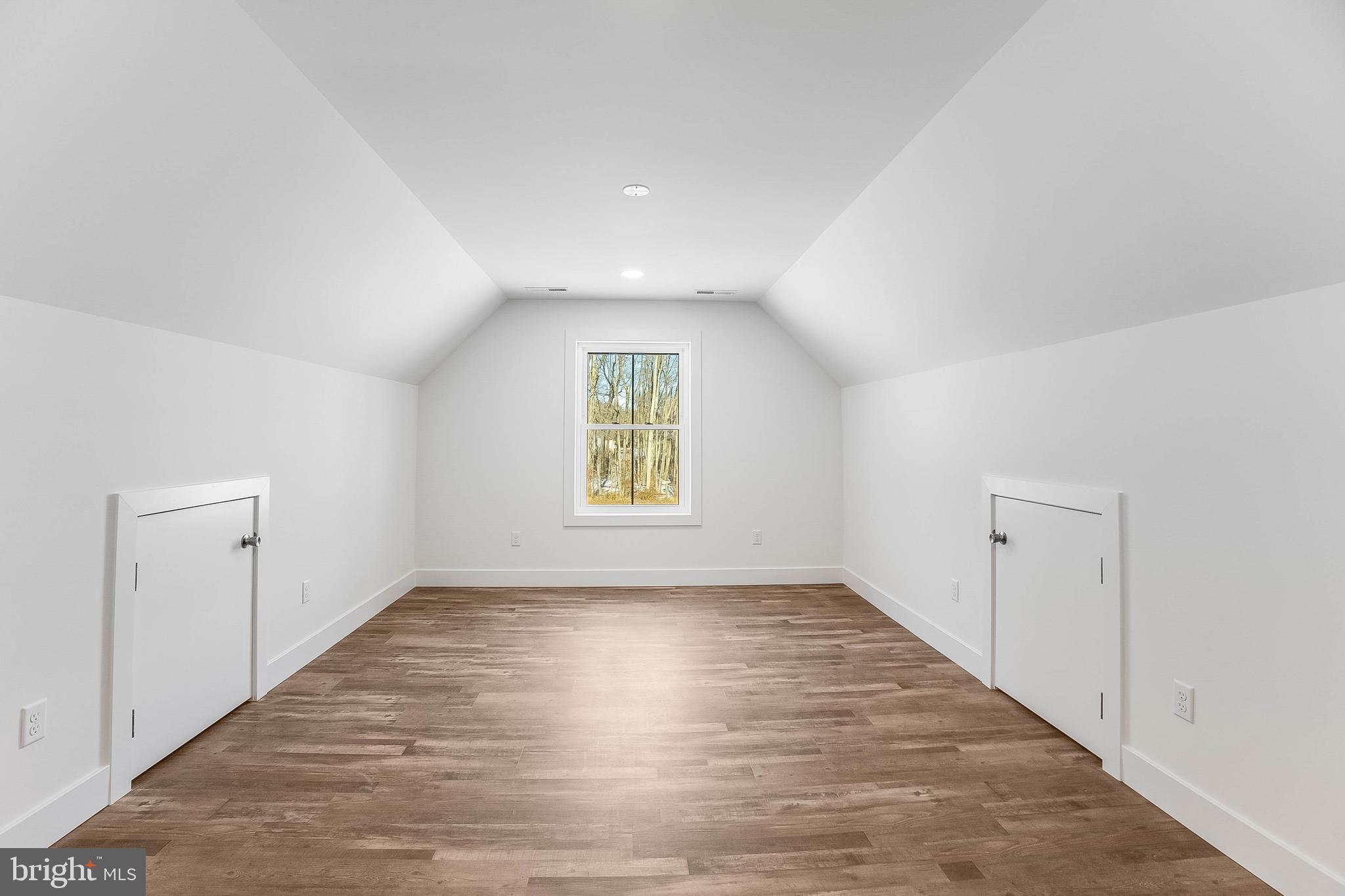 1255 Rose Valley School Road Dover, DE 19904 - Photo 20 of 26 an empty room with wooden floor and windows