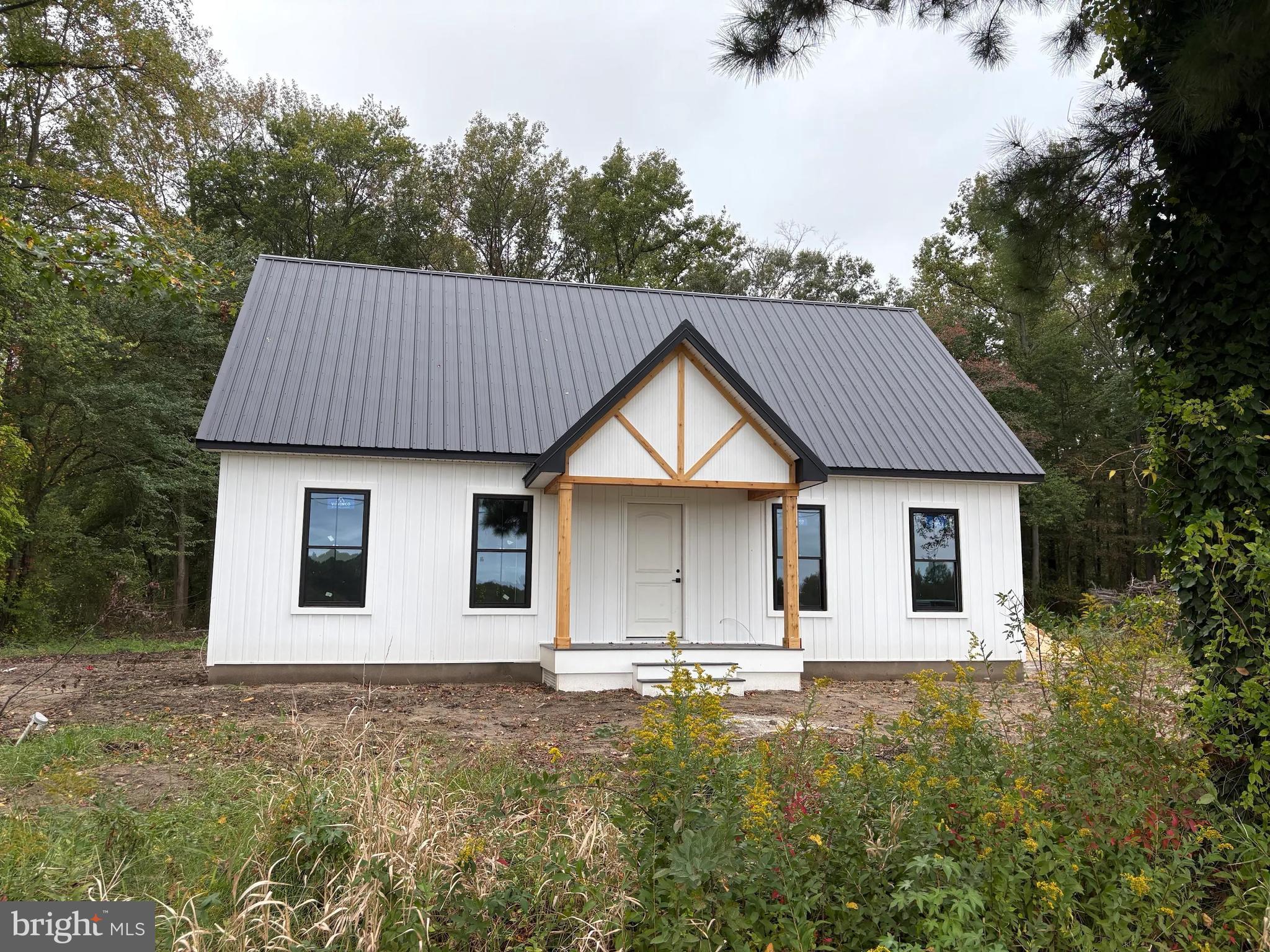 1255 Rose Valley School Road Dover, DE 19904 - Photo 2 of 26 a house that has a tree in front of it