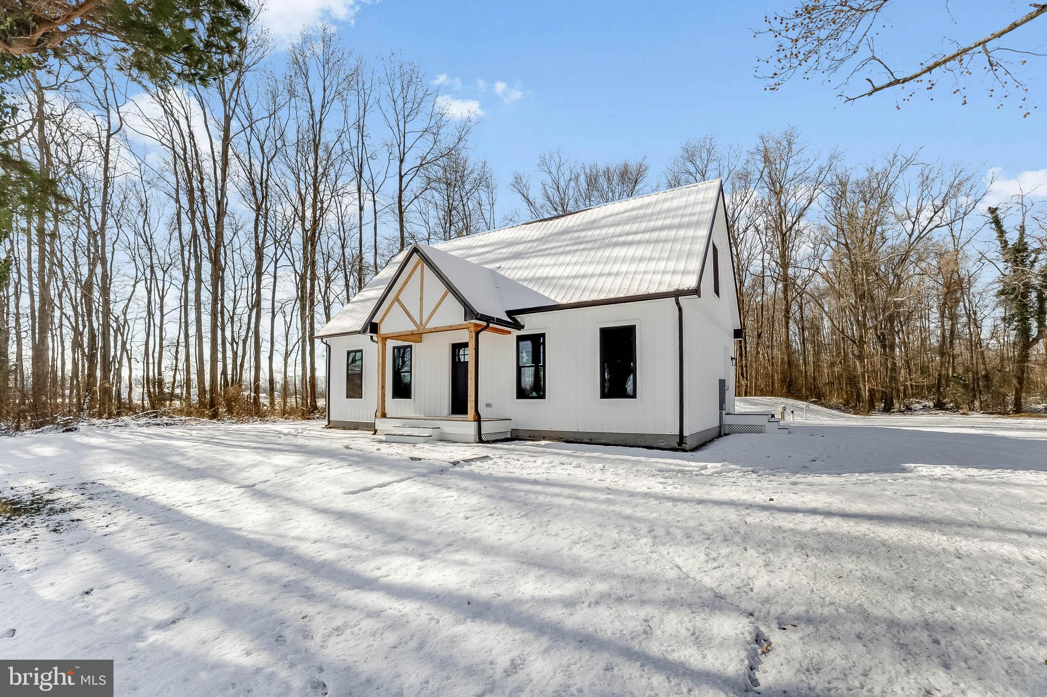 1255 Rose Valley School Road Dover, DE 19904 - Photo 23 of 26 a view of a house with a yard and covered with snow