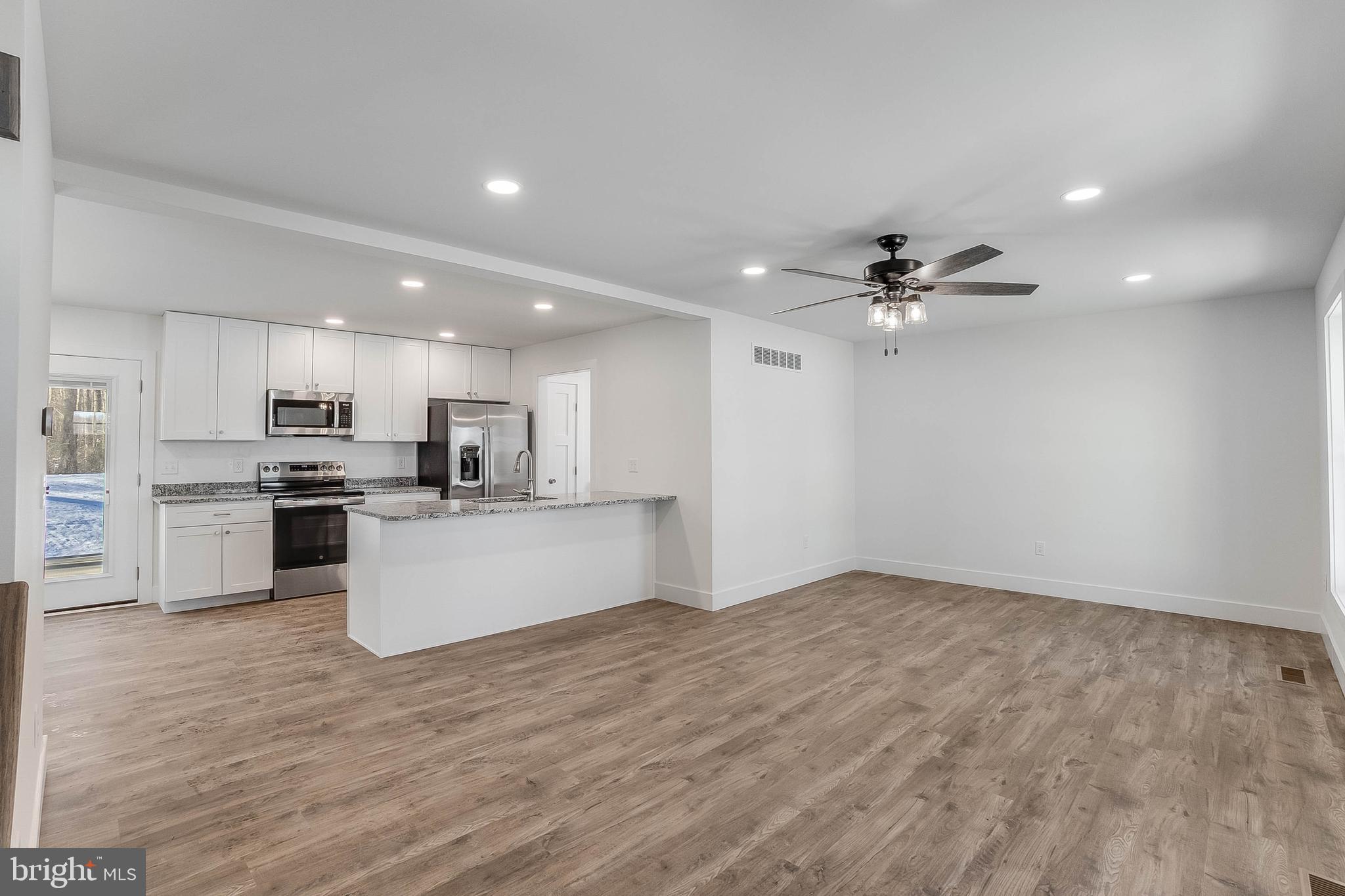 1255 Rose Valley School Road Dover, DE 19904 - Photo 3 of 26 a view of kitchen with refrigerator sink and white cabinets