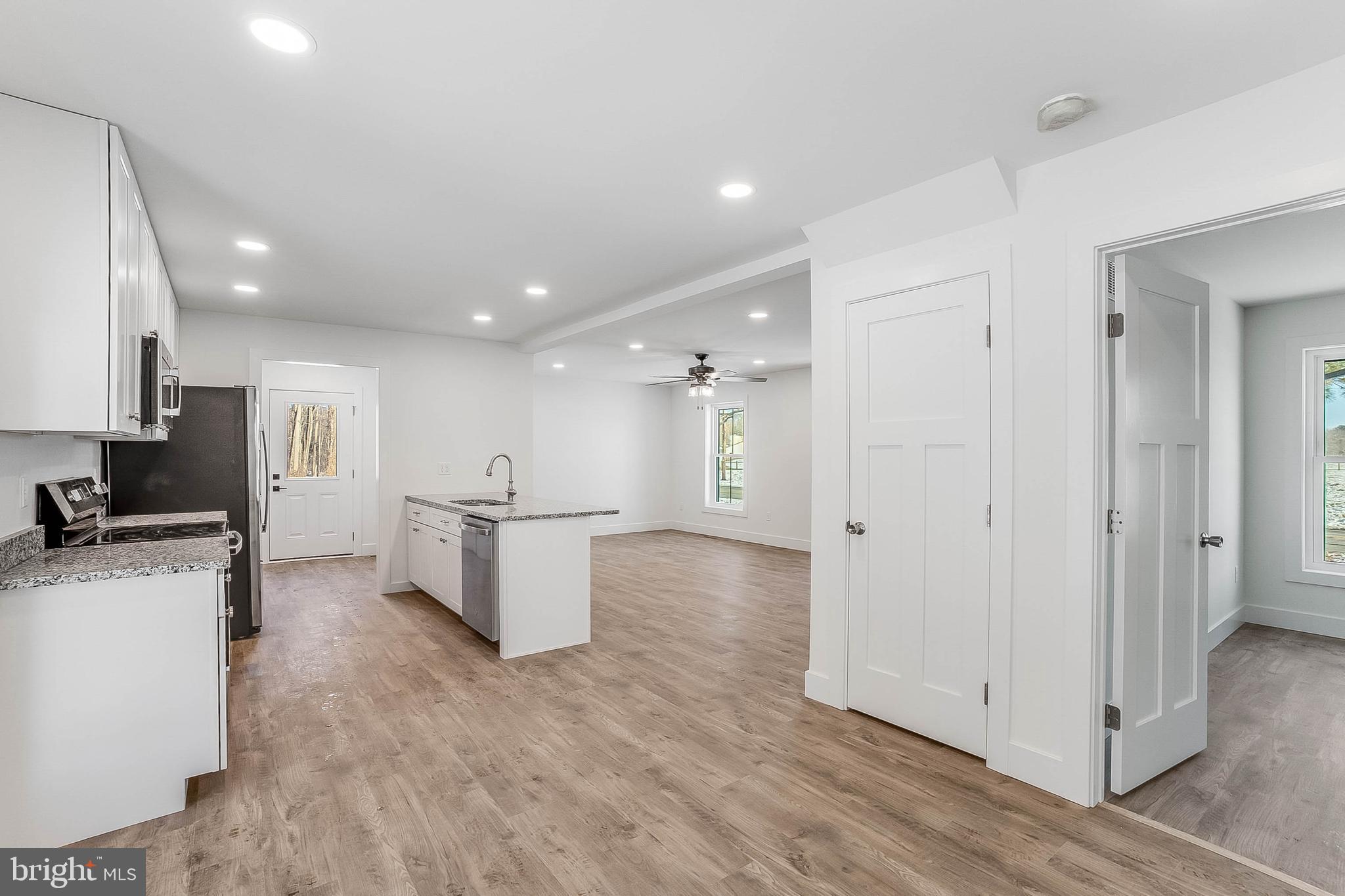 1255 Rose Valley School Road Dover, DE 19904 - Photo 6 of 26 a view of a kitchen with a refrigerator and a stove top oven