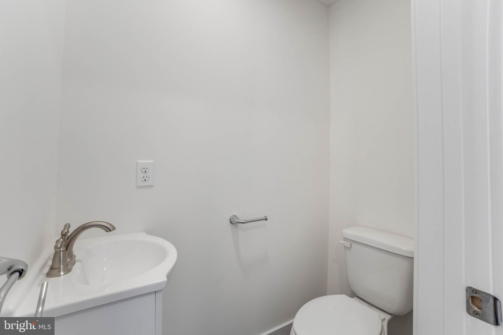 1255 Rose Valley School Road Dover, DE 19904 - Photo 10 of 26 a bathroom with a toilet sink and mirror