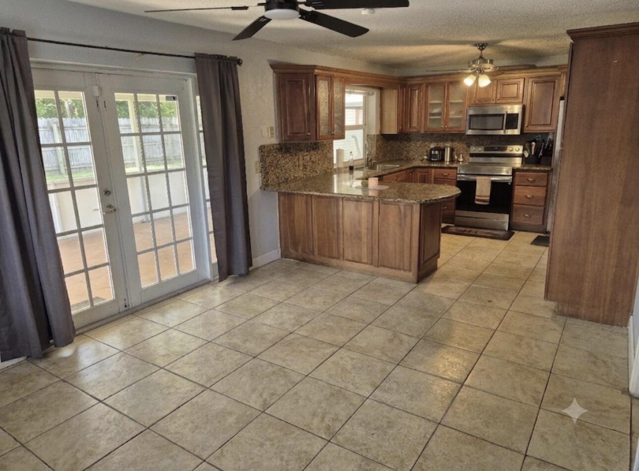 6301 Southwest 7th Street Margate, FL 33068 - Photo 5 of 17 Kitchen and family room