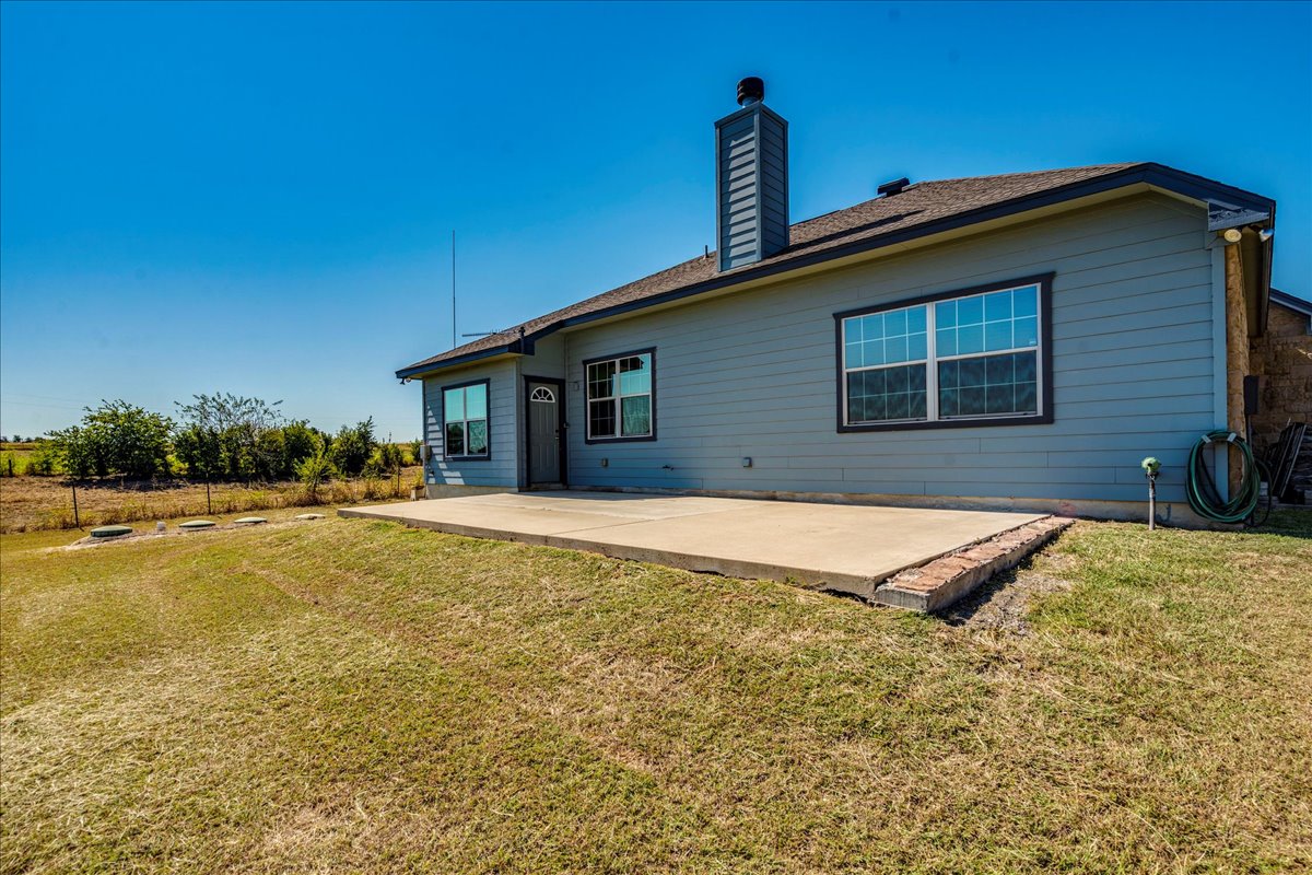 909 County Road 342 Granger, TX 76530 - Photo 32 of 37 Back of property with a large patio...great for entertaining