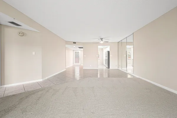 a view of an empty room with a window