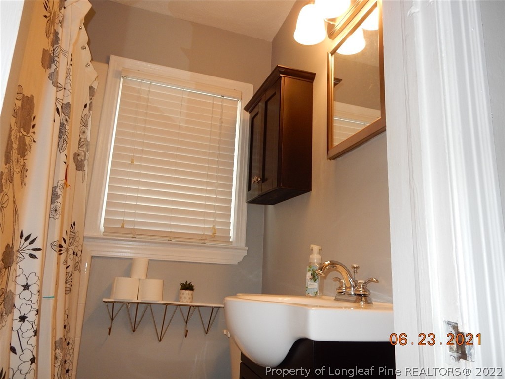 1001 Anarine Road Fayetteville, NC 28303 - Photo 12 of 24 a bathroom with a sink and a mirror