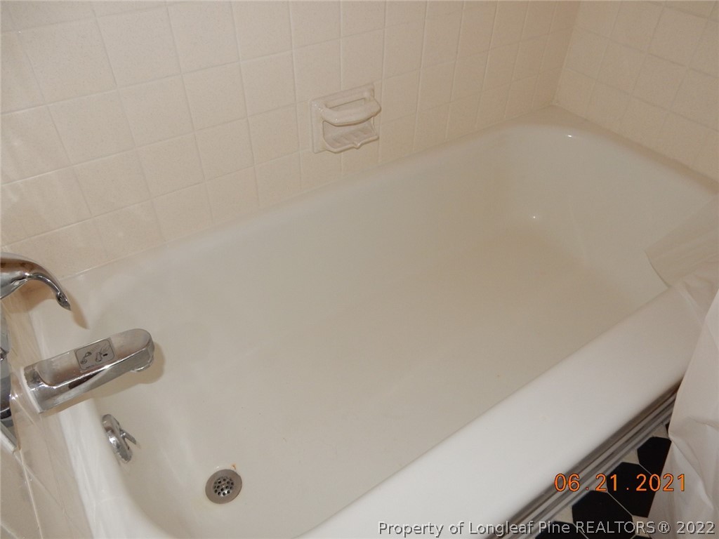 1001 Anarine Road Fayetteville, NC 28303 - Photo 13 of 24 a bathroom with a tub