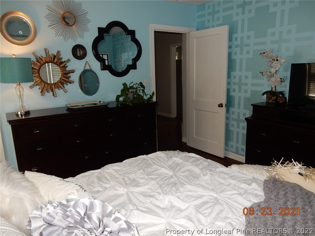 1001 Anarine Road Fayetteville, NC 28303 - Photo 16 of 24 a bedroom with a bed and cabinets
