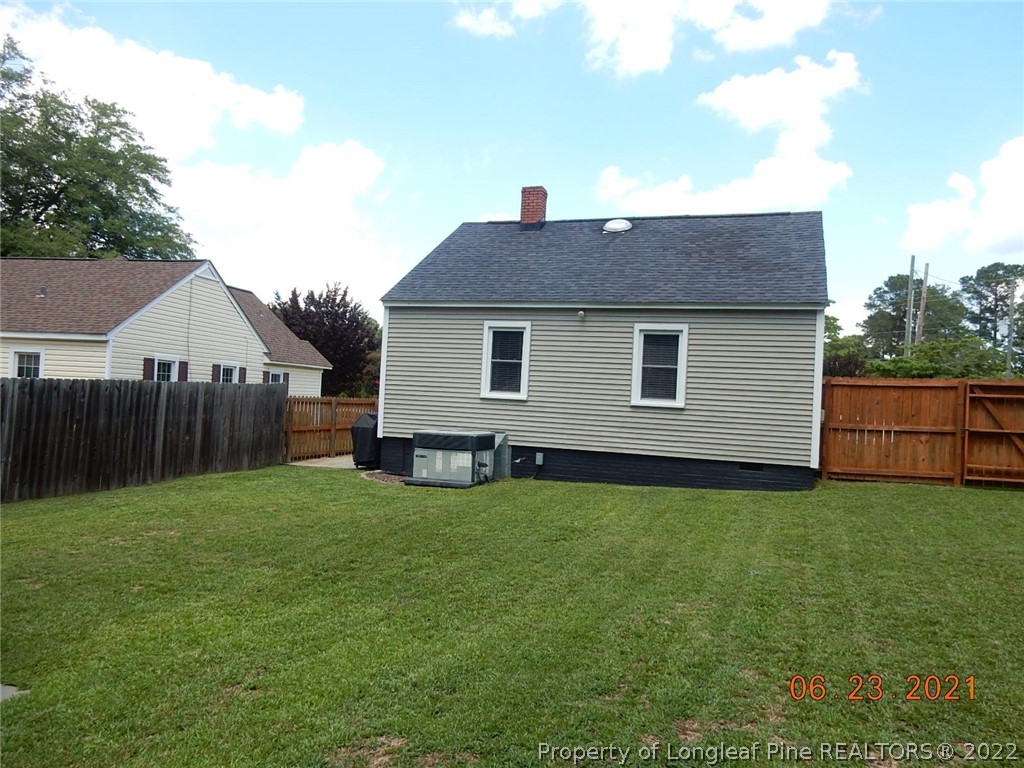1001 Anarine Road Fayetteville, NC 28303 - Photo 20 of 24 a backyard of a house with lots of green space