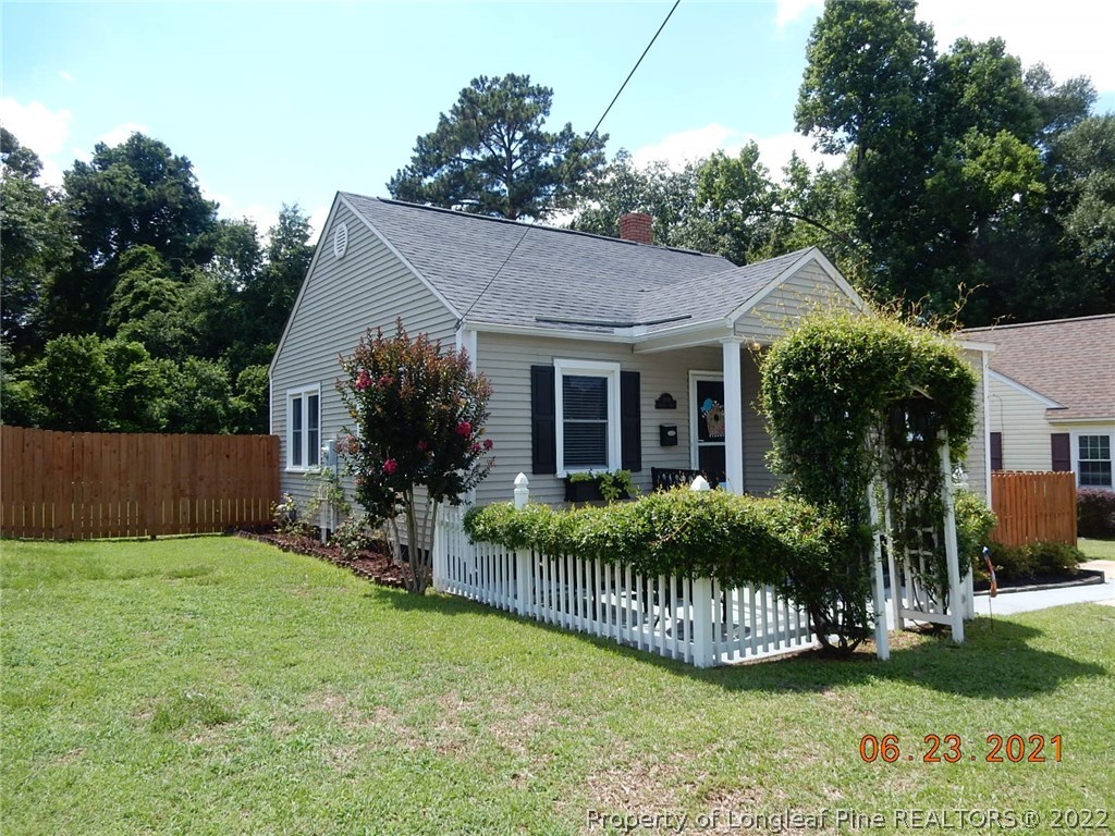 1001 Anarine Road Fayetteville, NC 28303 - Photo 2 of 24 a view of house with a yard and potted plants