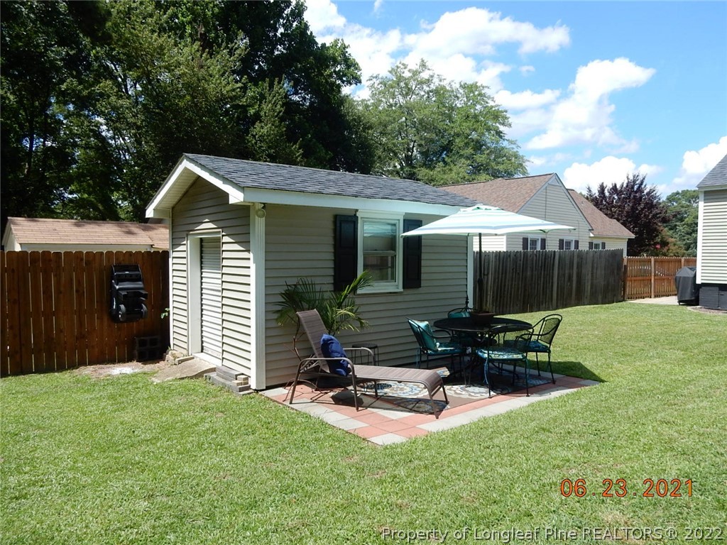 1001 Anarine Road Fayetteville, NC 28303 - Photo 22 of 24 a view of a chair and table in backyard of the house