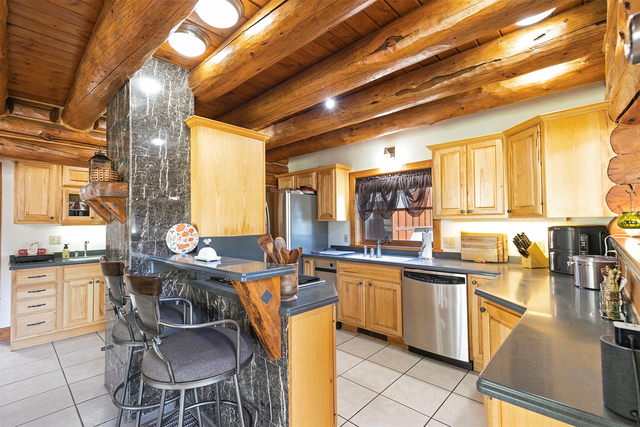 203 Hart Bench Road Darby, MT 59829 - Photo 9 of 56 With abundant counter space and thoughtful layout, the kitchen is both practical and inviting, ideal for those who love to cook and entertain.