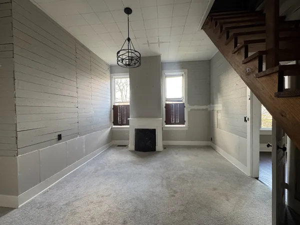 a view of a livingroom with a couch and chandelier