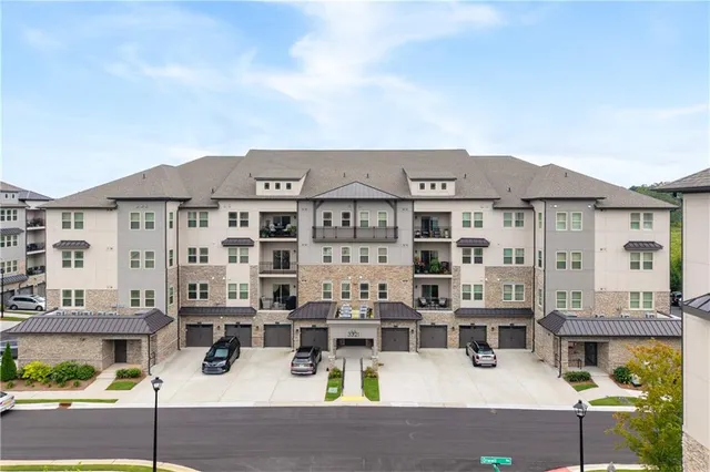 a view of multiple houses with a street