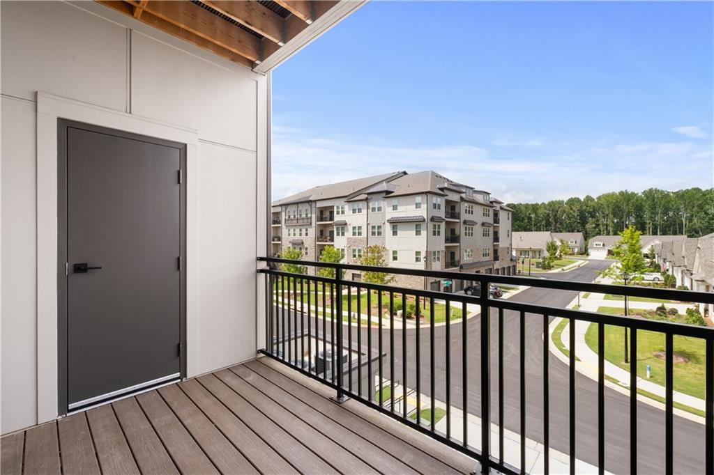 3321 Orwell Way, Unit 3301 Cumming, GA 30041 - Photo 30 of 43 a view of a houses with a balcony