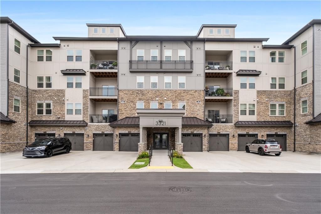 3321 Orwell Way, Unit 3301 Cumming, GA 30041 - Photo 3 of 43 a view of kitchen with stainless steel appliances and cabinets