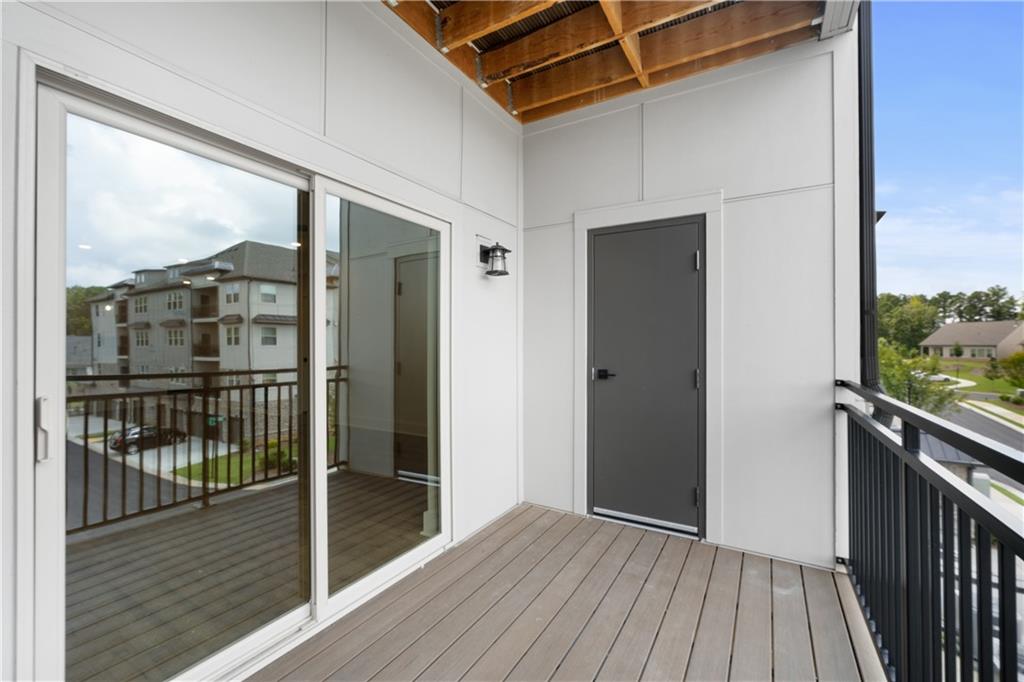 3321 Orwell Way, Unit 3301 Cumming, GA 30041 - Photo 31 of 43 a view of a balcony with wooden floor