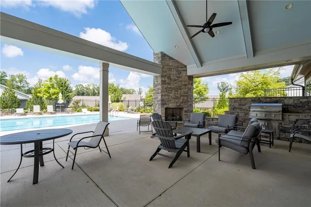 a view of a porch with furniture and a yard