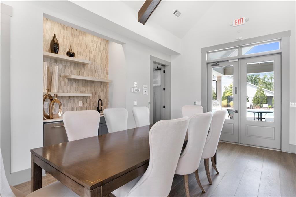 3321 Orwell Way, Unit 3301 Cumming, GA 30041 - Photo 39 of 43 a view of a dining room with furniture and wooden floor