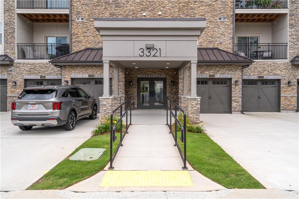 3321 Orwell Way, Unit 3301 Cumming, GA 30041 - Photo 4 of 43 a view of a car park in front of building