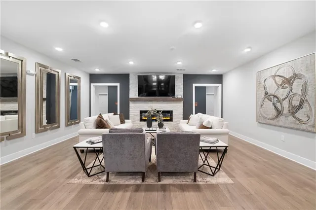 a living room with fireplace furniture and a flat screen tv