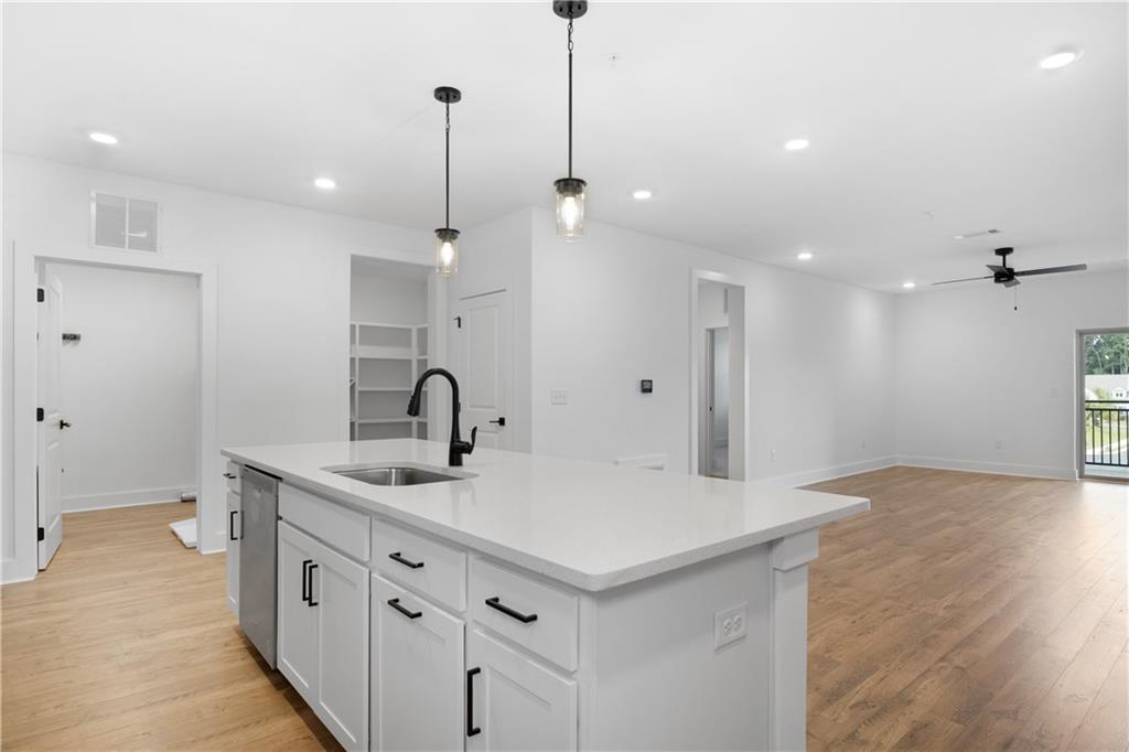 3321 Orwell Way, Unit 3301 Cumming, GA 30041 - Photo 9 of 43 a kitchen with a sink and a refrigerator