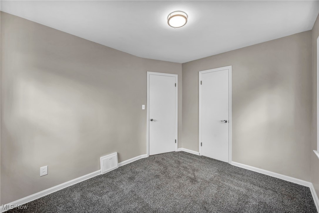 1560 Douglas Road Wickliffe, OH 44092 - Photo 23 of 39 Unfurnished room featuring carpet floors and baseboards