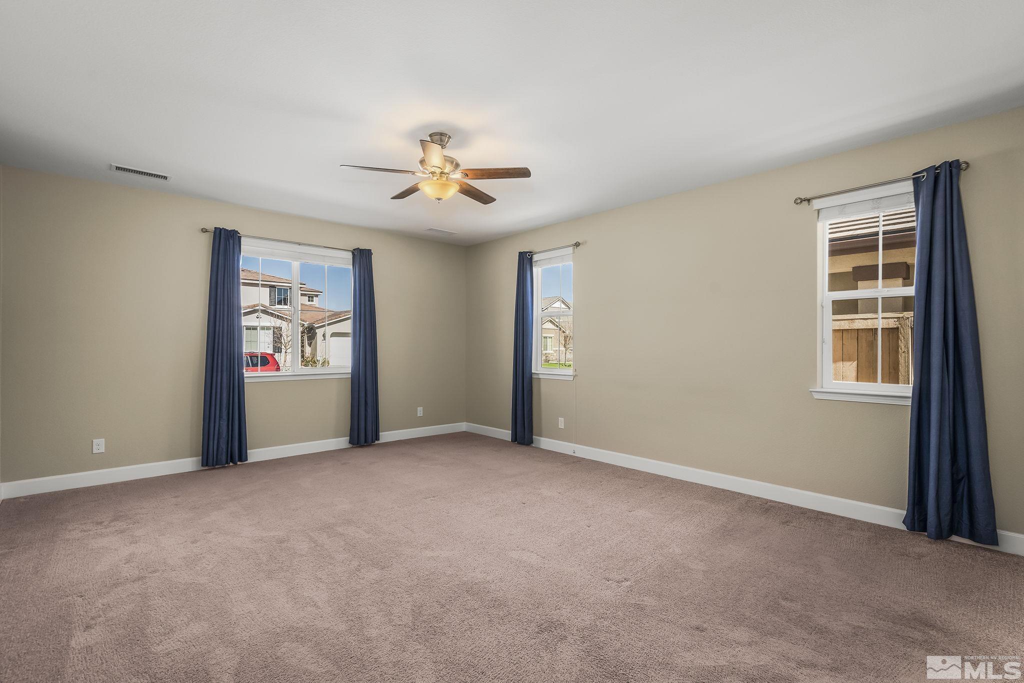 10320 Culiacan Pass Trail Reno, NV 89521 - Photo 17 of 33 a view of an empty room with a window