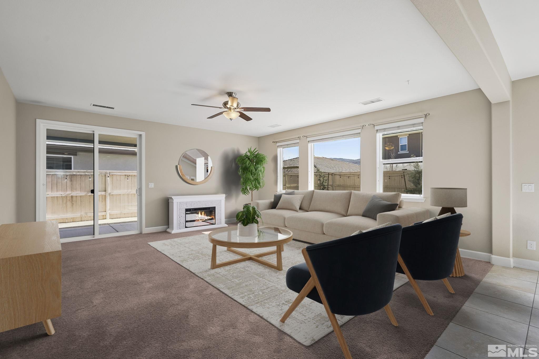 10320 Culiacan Pass Trail Reno, NV 89521 - Photo 3 of 33 a living room with fireplace furniture and a window